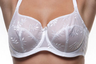 Breast should not slip underneath the band as you raise your hands. Go down a bra band size.